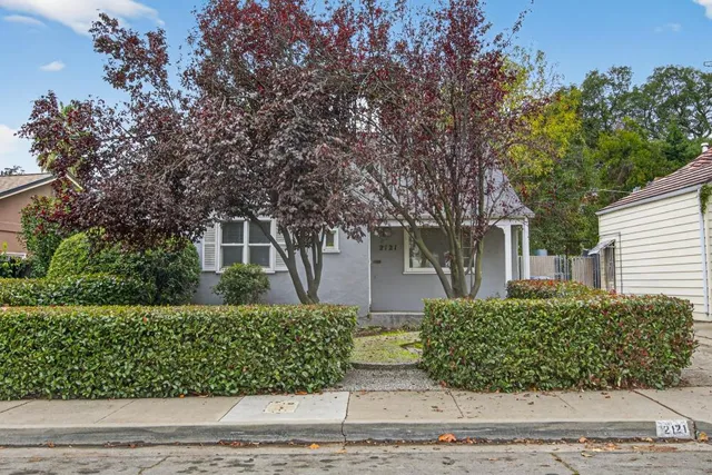 front view of a house with a small yard