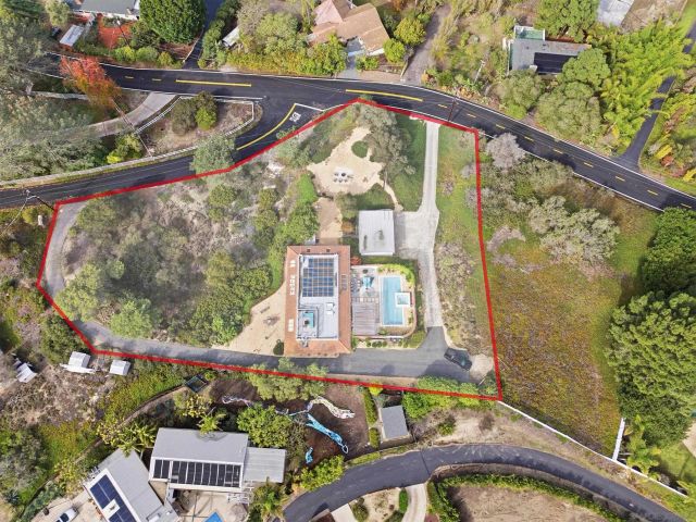 a view of a balcony with floor to ceiling windows and wooden fence