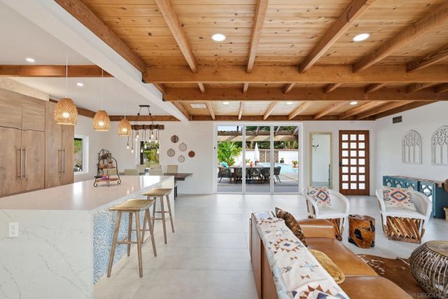 a very nice looking dining room with a large window