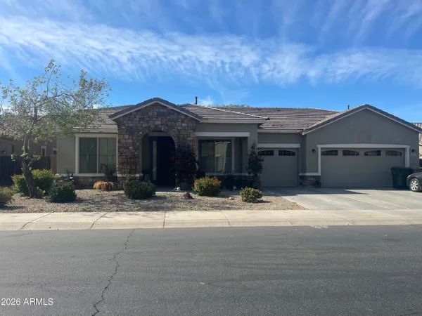 a front view of house with yard and outdoor seating