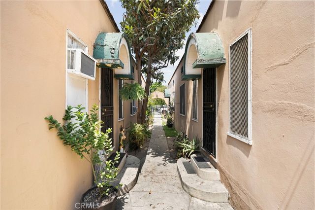 a front view of a house with outdoor seating