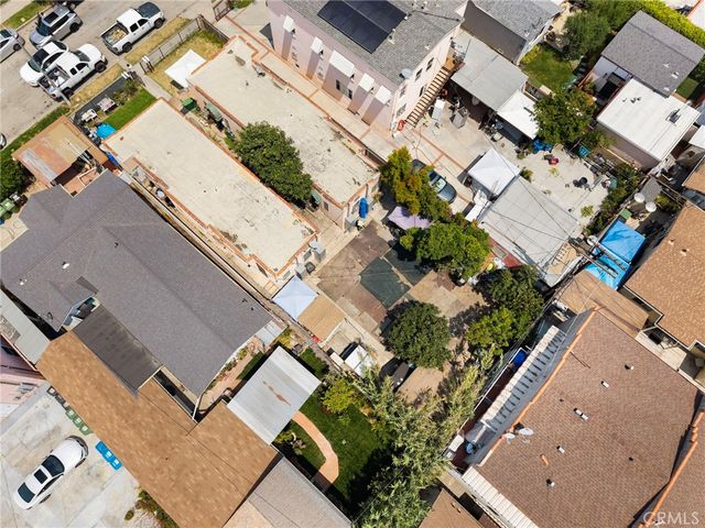 an aerial view of a residential apartment building with a yard