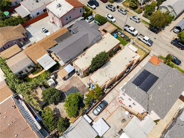 an aerial view of residential houses with outdoor space