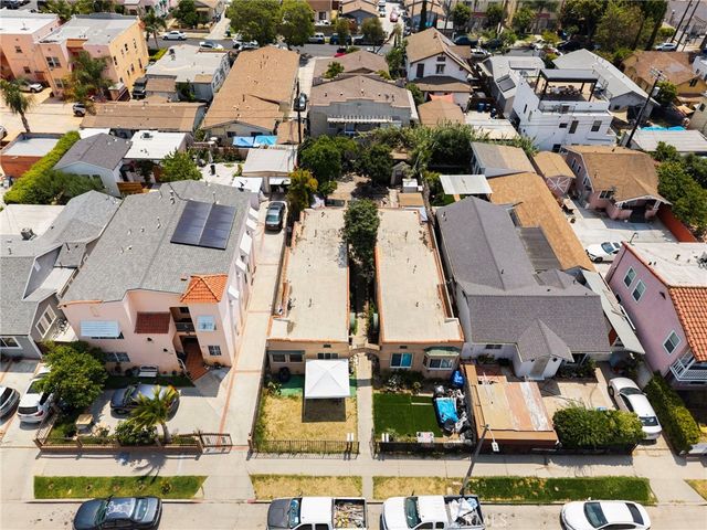 an aerial view of a houses with outdoor space and lake view