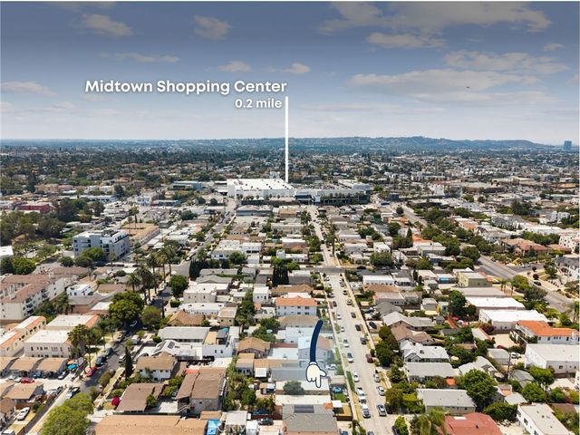 an aerial view of a city with lots of residential buildings