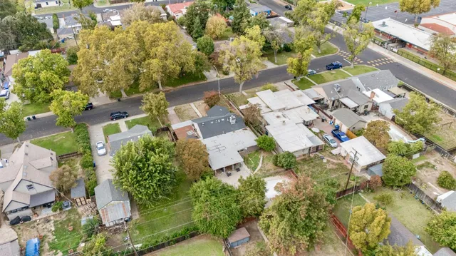 an aerial view of residential houses with outdoor space