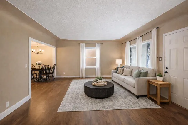 a living room with furniture and a table