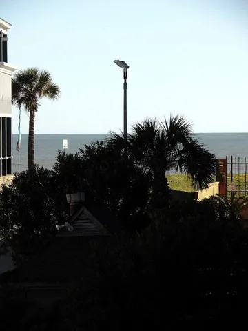 a bedroom with a bed and flat screen tv