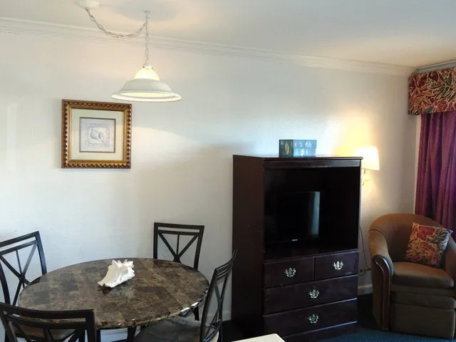 a kitchen with stainless steel appliances a stove a microwave a refrigerator and a sink