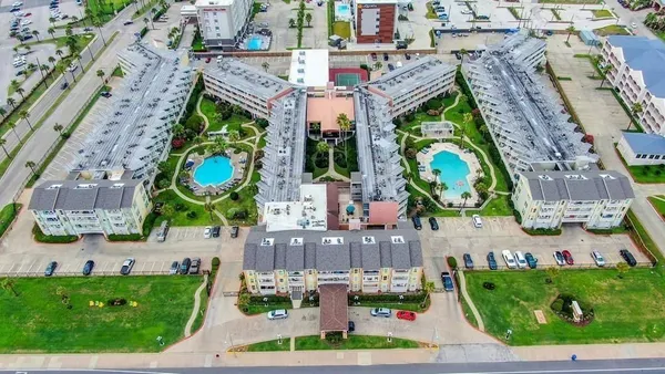 a view of a building with sitting area