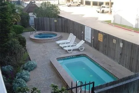 an aerial view of a residential apartment building with yard