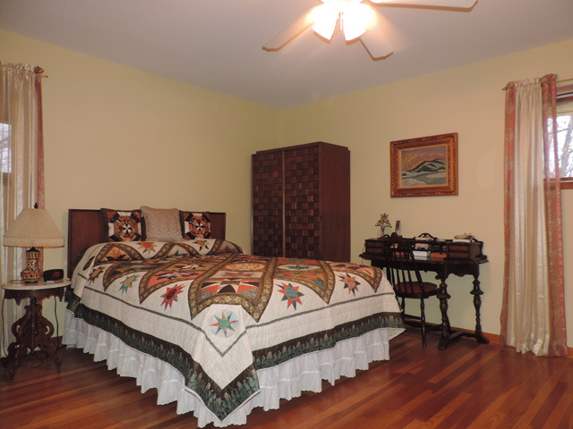 19610 West Manhattan Road Elwood, IL 60421 - Photo 11 of 17 a bedroom with a bed and wooden floor