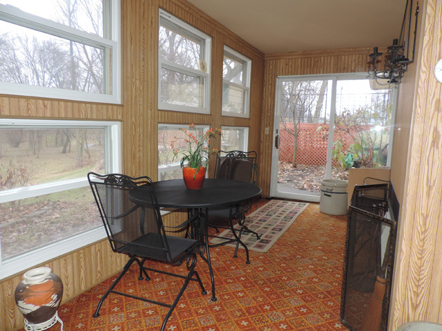 19610 West Manhattan Road Elwood, IL 60421 - Photo 14 of 17 a dining room with furniture a chandelier and wooden floor