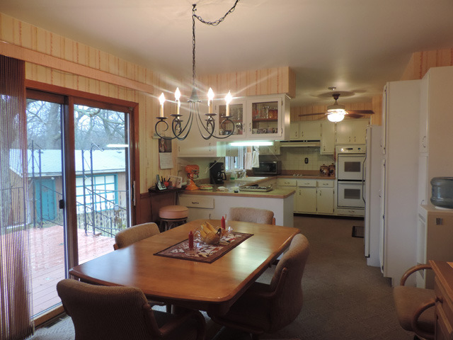 19610 West Manhattan Road Elwood, IL 60421 - Photo 7 of 17 a view of a dining room with furniture wooden floor and chandelier