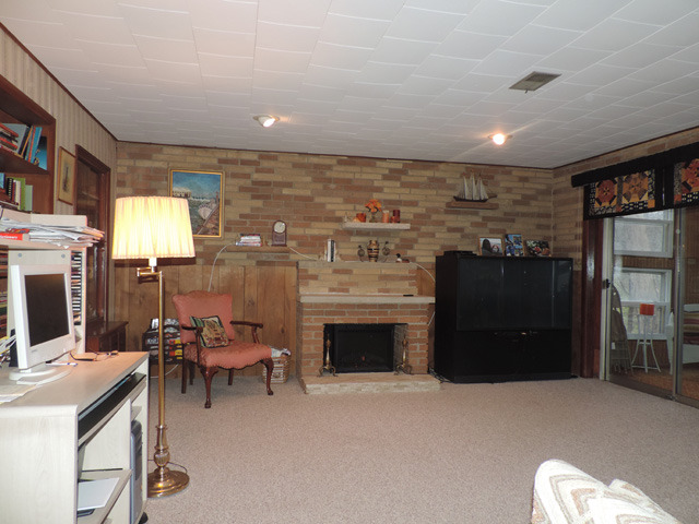 19610 West Manhattan Road Elwood, IL 60421 - Photo 10 of 17 a room with furniture and a fireplace