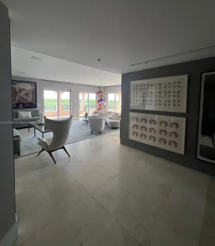 a view of workspace with furniture and window