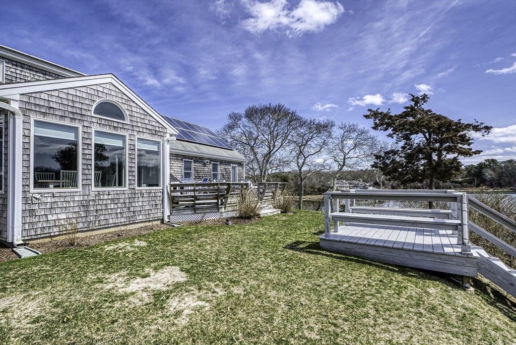 31 Baxendale Road Bourne, MA 02534 - Photo 13 of 35 a view of house with backyard and outdoor seating