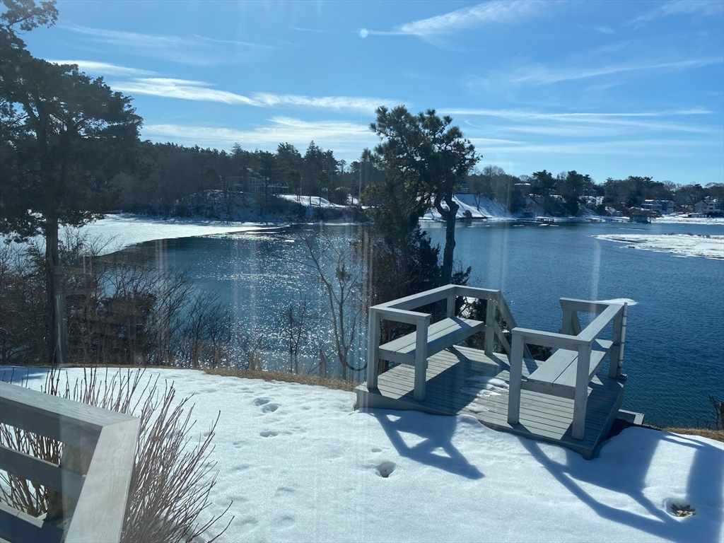 31 Baxendale Road Bourne, MA 02534 - Photo 15 of 36 a backyard of a house with table and chairs