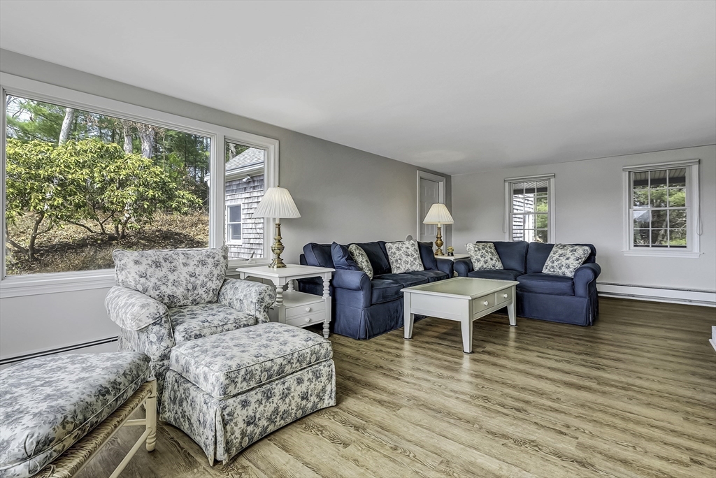 31 Baxendale Road Bourne, MA 02534 - Photo 18 of 36 a living room with furniture and a large window
