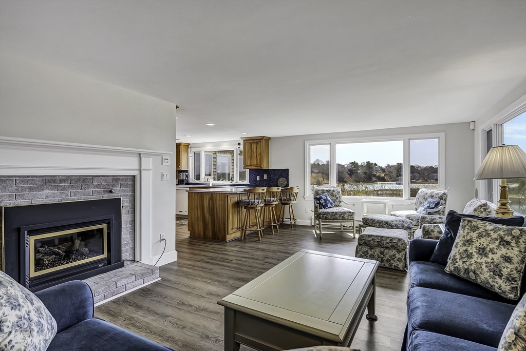 31 Baxendale Road Bourne, MA 02534 - Photo 19 of 36 a living room with furniture and a fireplace