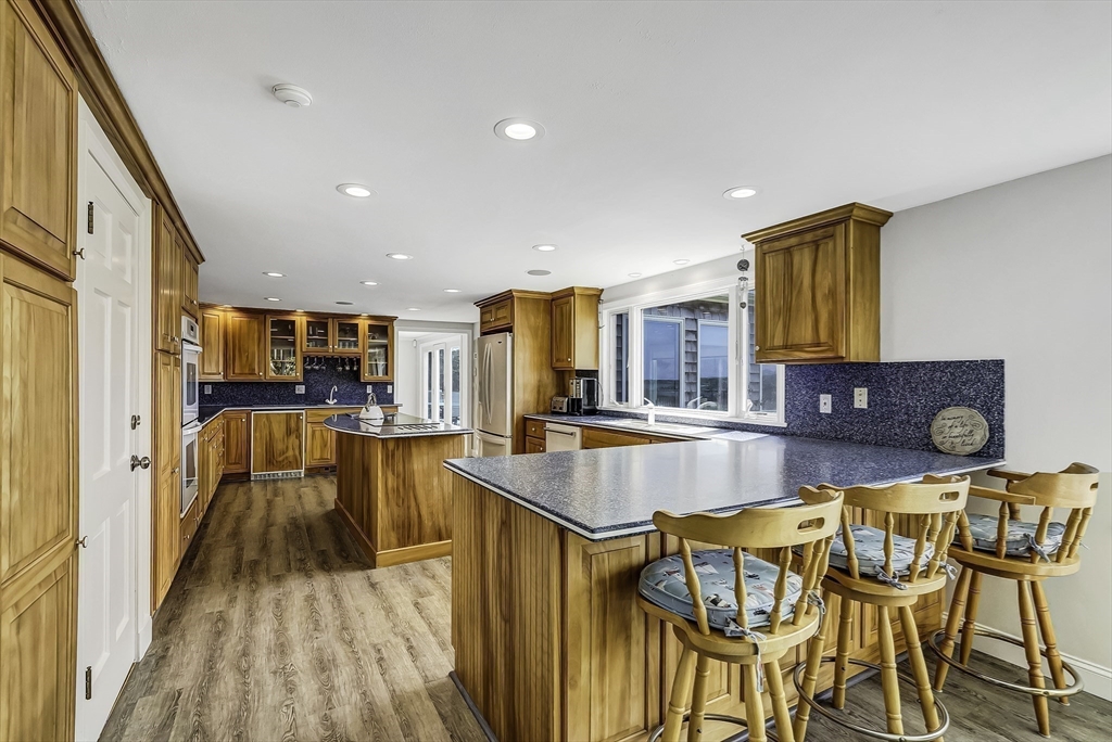 31 Baxendale Road Bourne, MA 02534 - Photo 22 of 36 a room with table chairs and wooden floor