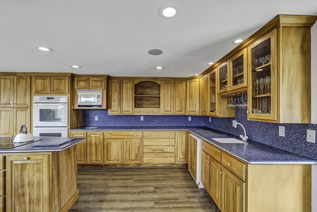 31 Baxendale Road Bourne, MA 02534 - Photo 22 of 35 a kitchen with stainless steel appliances granite countertop a sink and cabinets
