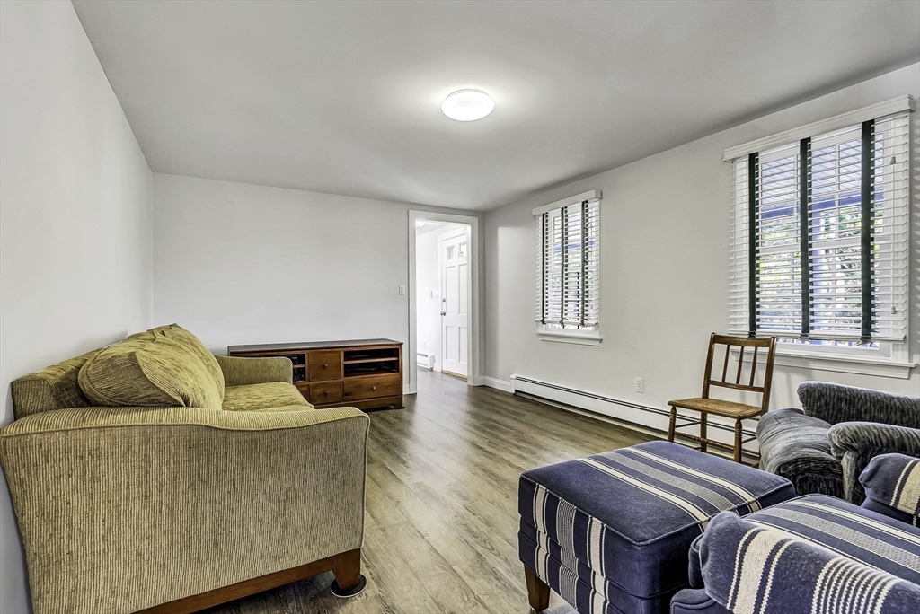 31 Baxendale Road Bourne, MA 02534 - Photo 32 of 35 a living room with furniture and wooden floor