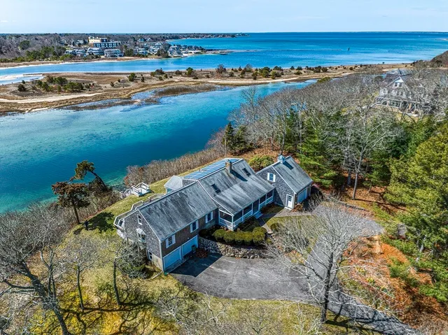 an aerial view of a house with a lake view