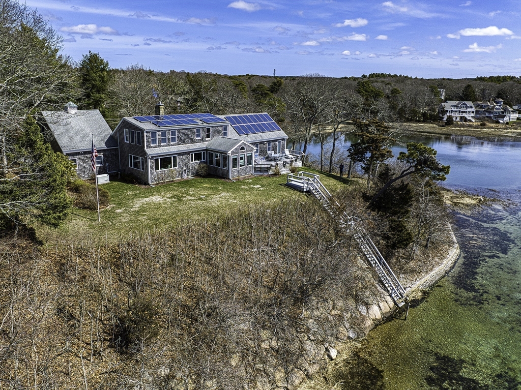 31 Baxendale Road Bourne, MA 02534 - Photo 10 of 35 a aerial view of a house with a yard basket ball court and outdoor seating