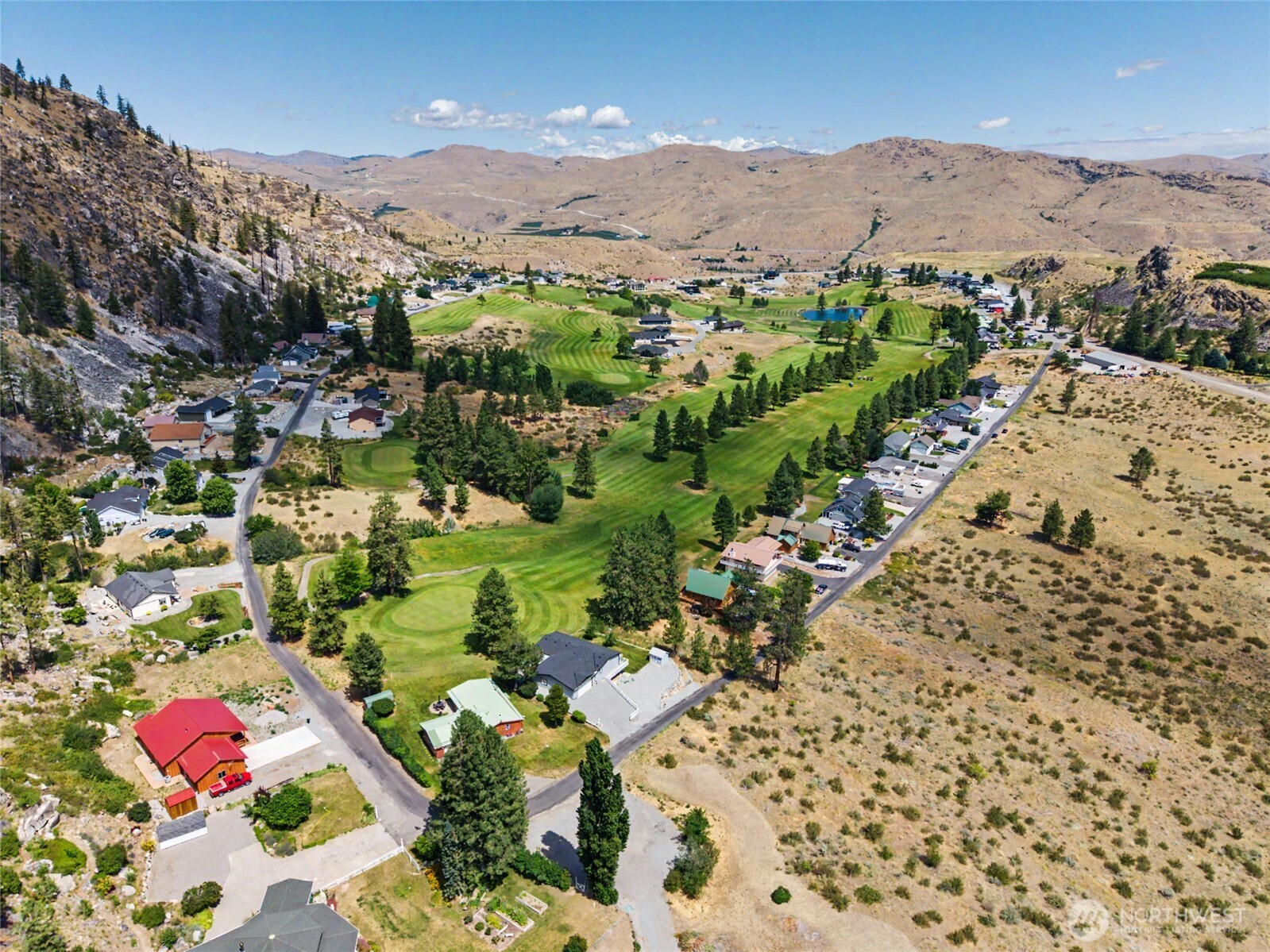 93 Golf Course Drive Pateros, WA 98846 - Photo 33 of 34 an aerial view of residential houses with outdoor space