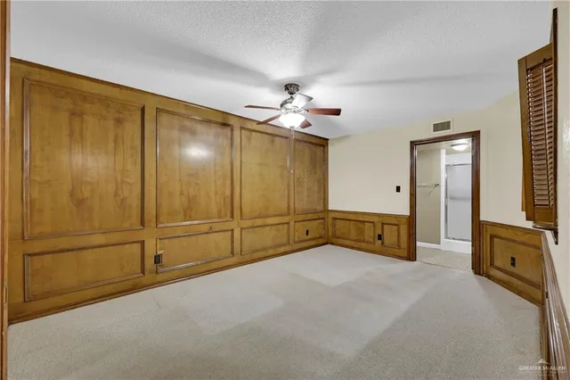 wooden floor in an empty room with a fireplace