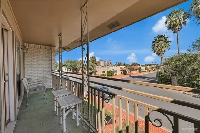 a view of a balcony with chairs