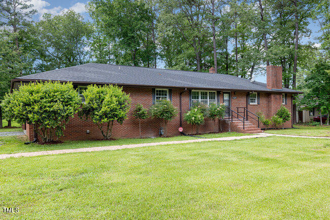 3610 Randolph Road Durham, NC 27705 - Photo 1 of 29 a front view of a house with a garden