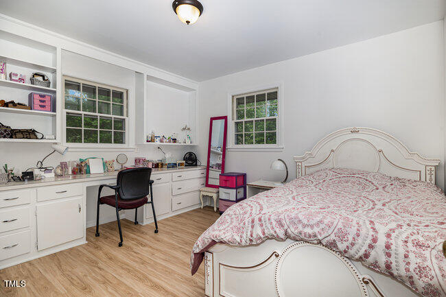 3610 Randolph Road Durham, NC 27705 - Photo 13 of 29 a bedroom with a bed window and a table chair