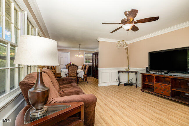 3610 Randolph Road Durham, NC 27705 - Photo 20 of 29 a living room with furniture and a flat screen tv