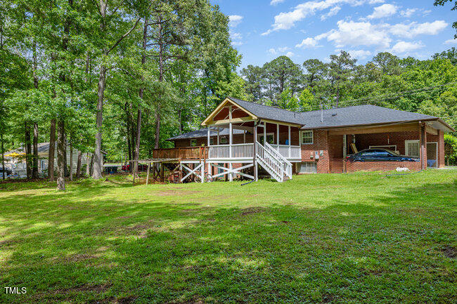 3610 Randolph Road Durham, NC 27705 - Photo 24 of 29 a front view of a house with a garden and trees