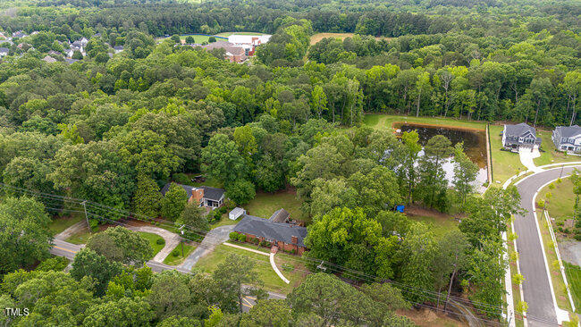 3610 Randolph Road Durham, NC 27705 - Photo 26 of 29 an aerial view of a house with a yard and lake view