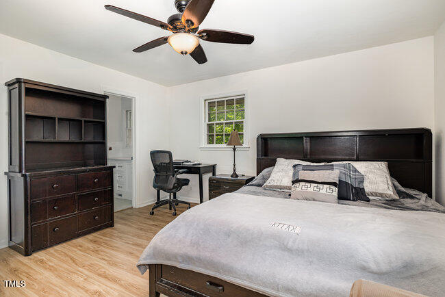 3610 Randolph Road Durham, NC 27705 - Photo 10 of 29 a bedroom with a bed and a dresser