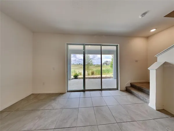 a view of an empty room and window