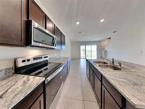 a kitchen with a stove and a microwave