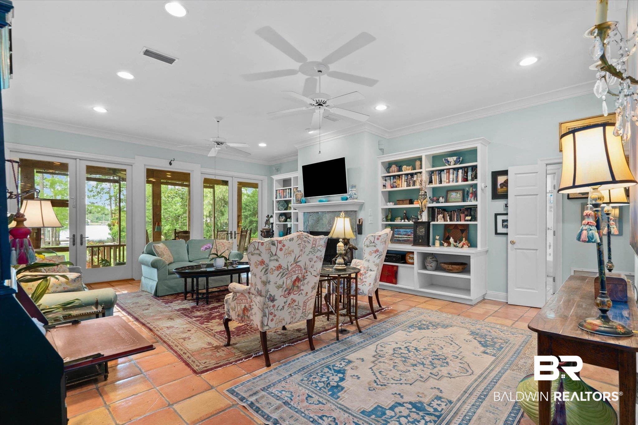 8841 Escambia Avenue Elberta, AL 36530 - Photo 6 of 66 Featuring the fireplace and the floor to ceiling windows overlooking the back porch and with view of the water.