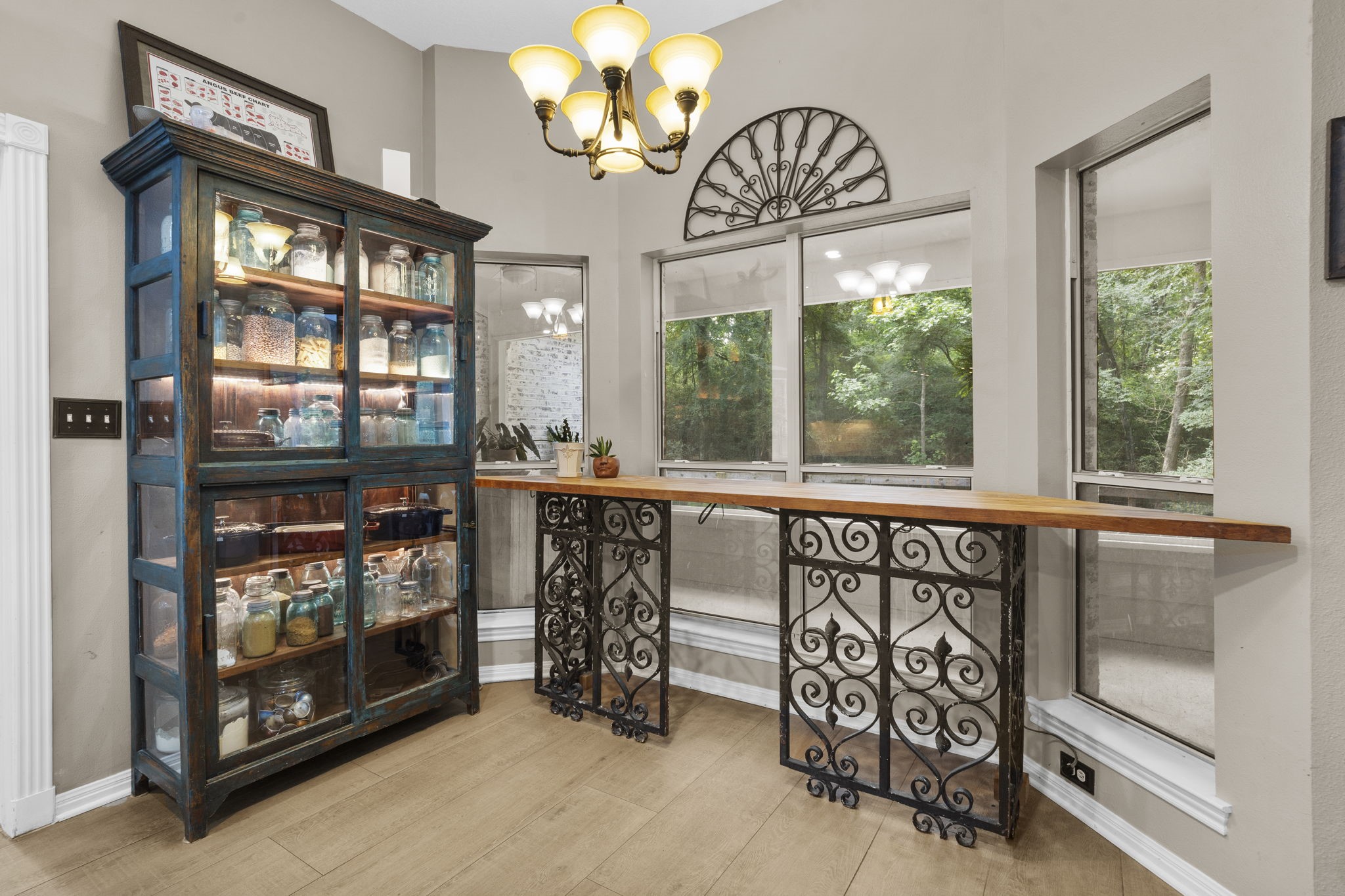 19610 Timber Ridge Drive Magnolia, TX 77355 - Photo 17 of 50 Located just off the kitchen, the bright breakfast room features large windows that fill the space with natural light, while elegant chandelier lighting adds warmth and charm.