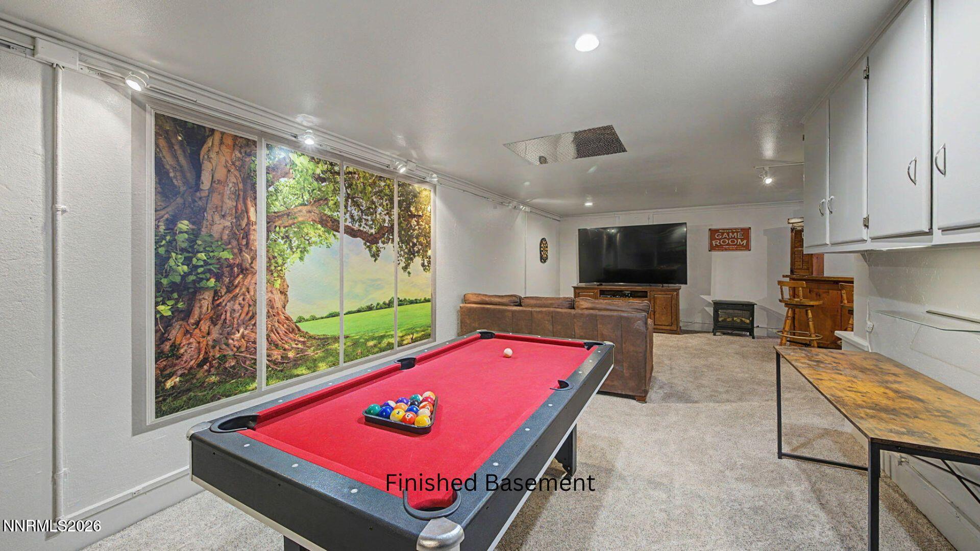 4920 Plumas Street Reno, NV 89509 - Photo 21 of 36 a room with pool table and windows