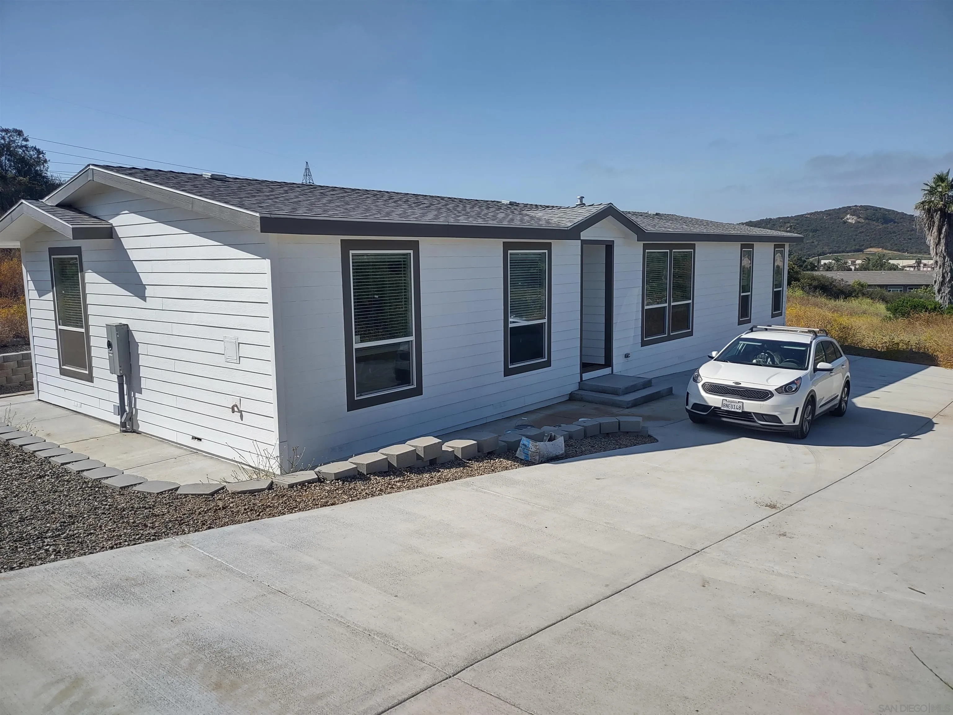 25573 Rua Michelle Escondido, CA 92026 - Photo 1 of 5 a car parked in front of house