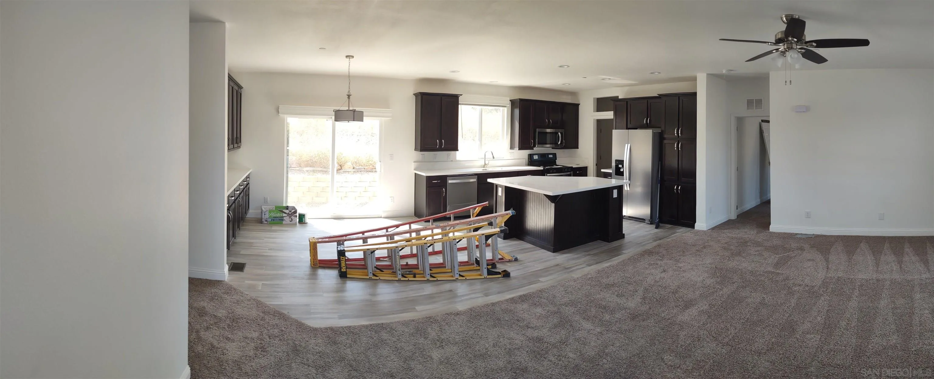 25573 Rua Michelle Escondido, CA 92026 - Photo 3 of 5 a kitchen with a refrigerator and a sink