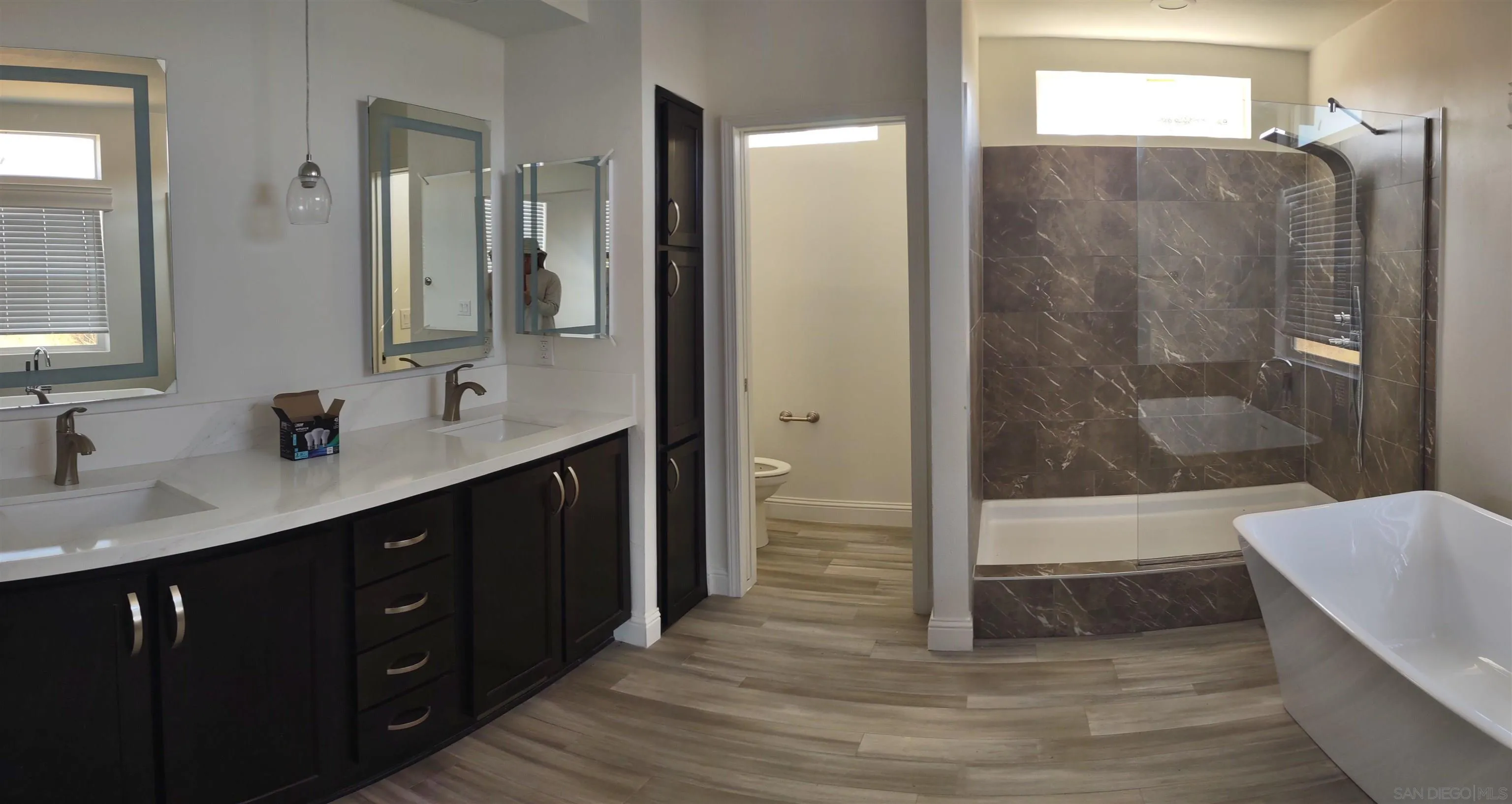 25573 Rua Michelle Escondido, CA 92026 - Photo 4 of 5 a bathroom with a double vanity sink a large mirror and shower
