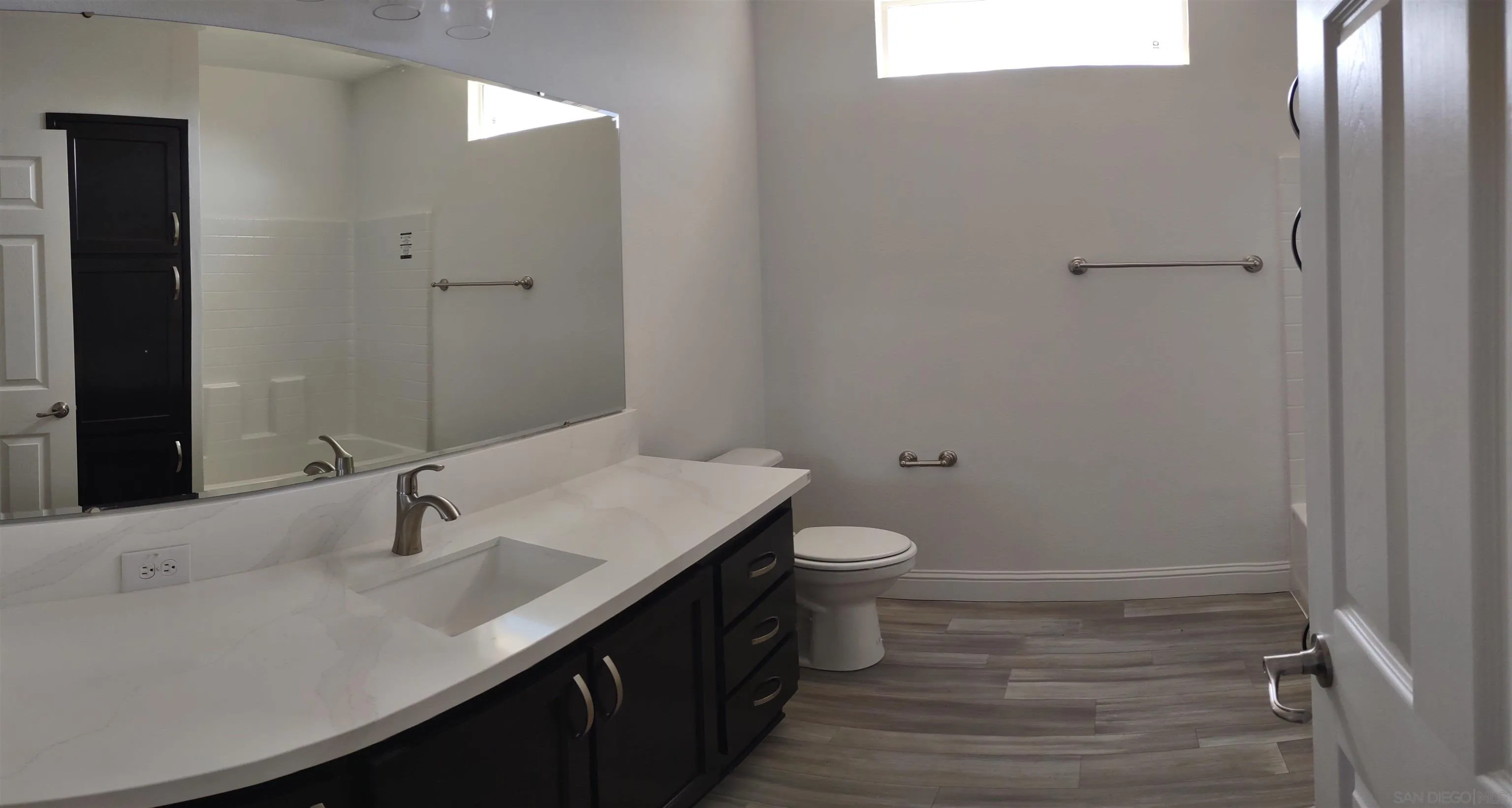 25573 Rua Michelle Escondido, CA 92026 - Photo 5 of 5 a bathroom with a sink toilet and vanity