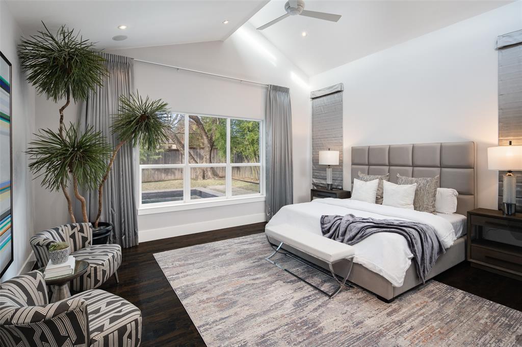 5811 Meletio Lane Dallas, TX 75230 - Photo 12 of 31 a spacious bedroom with a large bed and a couch