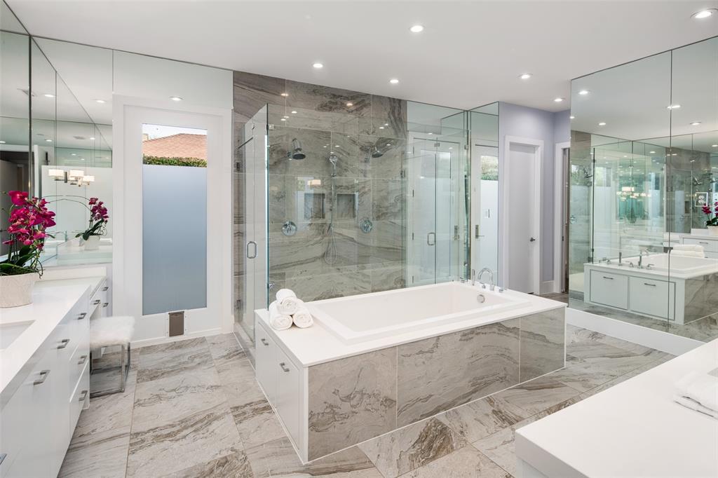 5811 Meletio Lane Dallas, TX 75230 - Photo 13 of 31 a large bathroom with a tub shower and sink
