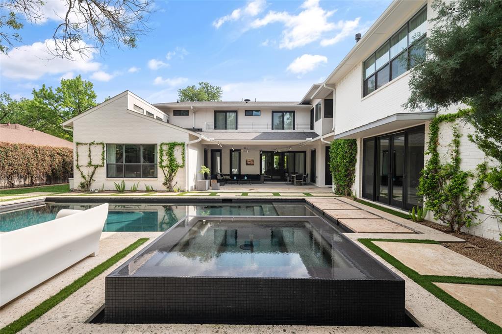 5811 Meletio Lane Dallas, TX 75230 - Photo 2 of 31 a view of house with swimming pool outdoor seating